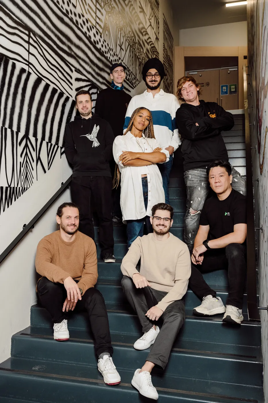 Startup Program founders and the XRPL Commons team on the stairs at the Paris office